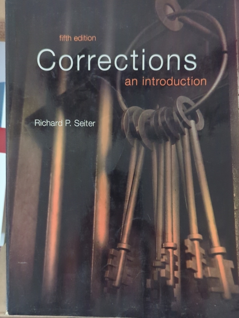 Pearson Corrections: An Introduction — Black and Bronze Key Illustration